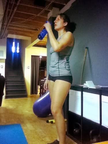 Tired athlete resting after a workout in a gym